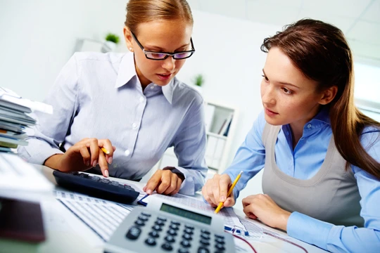 Diverse professionals analyzing documents happily